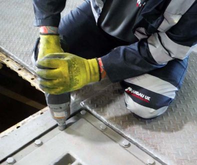 Landau maintenance worker fastening hatch bolts
